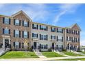 Inviting townhouse exteriors with well-kept lawns, classic black shutters, and blue skies overhead at 17269 Dallington St, Westfield, IN 46074
