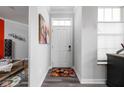 Inviting hallway with hardwood floors and a charming entryway rug at 17302 Graley Pl, Westfield, IN 46074