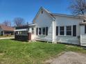 Side view of home with windows and small porch at 1901 S F St, Elwood, IN 46036