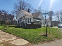 View of home at corner with sidewalk and street sign at 1901 S F St, Elwood, IN 46036