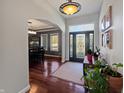 Warm foyer offers seamless transition into the dining room through elegant archway at 1995 Brookfield Ct, Columbus, IN 47201