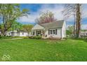 Delightful property featuring a well-kept yard and classic design elements at 2204 Pamela Dr, Indianapolis, IN 46220
