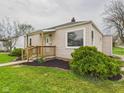 Charming single-story home with a well-maintained lawn and walkway leading to the front door at 301 E 34Th St, Anderson, IN 46013