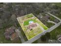 Aerial of the property highlighting its expansive lot, in-ground pool, landscaping, and neighborhood setting at 3331 Daniel St, Mooresville, IN 46158