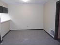 A room with neutral walls and carpet, offering a blank canvas for customization at 3744 Tudor Park Dr # 2, Indianapolis, IN 46235
