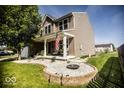 Charming two-story home with a front porch that's landscaped with stones and shrubs at 3896 Woods Bay Ln, Plainfield, IN 46168