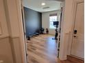 A brightly lit room provides the perfect exercise space, with hardwood floors and ample natural light at 4810 Oak Hl Dr, Lebanon, IN 46052