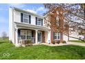 Charming home featuring a blend of brick and siding, complemented by a lush front lawn at 4922 Birmingham Dr, Indianapolis, IN 46235