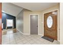 Inviting entryway with tile flooring, decorative front door, and access to living space at 5126 Shadow Pointe Dr, Indianapolis, IN 46254