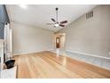 Bright living room showcasing hardwood floors and a cozy ambiance with neutral walls at 5126 Shadow Pointe Dr, Indianapolis, IN 46254