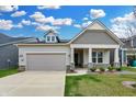 Charming single-Gathering home featuring a gray and beige exterior, a two-car garage, and a well-manicured lawn at 5309 Spyglass Dr, Whitestown, IN 46075