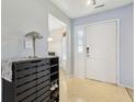 Bright entryway with a shoe rack and white door at 7048 Tassel Meadow Dr, Indianapolis, IN 46217