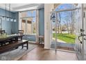 Bright dining room features a large window, a modern light fixture, and stylish decor at 7424 Campfire Run, Indianapolis, IN 46236