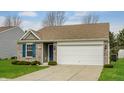 Attractive single-story home featuring a brick facade, attached two-car garage, and a well-manicured front lawn at 7782 Rose Ln, Ingalls, IN 46048