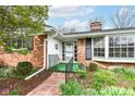 Inviting front porch with a small seating area and a decorative wreath on the door at 80 S Richland Ave, Carmel, IN 46032