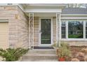 Charming front door entrance with stone and decorative metal accents at 928 Forest Blvd N Dr, Indianapolis, IN 46240