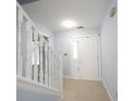 Bright foyer features tile flooring, a white staircase, and a white front door with glass panels at 12516 Schoolhouse Rd, Fishers, IN 46037
