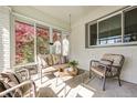 Sunroom with ample seating, natural light, and views of the landscaped yard at 138 Fairway Dr, Indianapolis, IN 46260