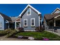 Charming home with a manicured lawn, beautiful flowers, and inviting curb appeal at 1626 S Delaware St, Indianapolis, IN 46225