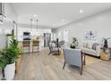 Bright, open-concept living area with modern decor, wood floors, and a seamless flow into the kitchen at 2352 Stuart St, Indianapolis, IN 46218