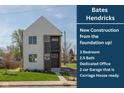 New construction featuring a modern elevation, showcasing a light gray exterior and a well-manicured lawn at 315 E Minnesota St, Indianapolis, IN 46225