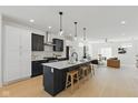 Modern kitchen with stainless appliances, white countertops, and an island with seating at 315 E Minnesota St, Indianapolis, IN 46225