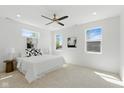 Bright main bedroom featuring a large bed, neutral decor, and ample natural light at 315 E Minnesota St, Indianapolis, IN 46225
