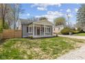 Charming bungalow with gray siding, crisp white trim, and a cozy front porch at 3624 Wallace Ave, Indianapolis, IN 46218