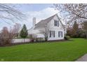 Exterior home with well-manicured lawn and a view of backyard fence at 443 Quincy Pl, Westfield, IN 46074