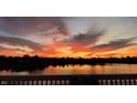 Beautiful panoramic view of a sunset over the lake, creating a scenic landscape at 4883 Snowberry Bay Ct, Carmel, IN 46033