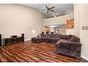 Spacious living room with high ceilings, hardwood floors, and comfortable brown sectional sofa at 4916 Franklin Villas Dr, Indianapolis, IN 46237