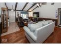 Open living room with hardwood floors, a vaulted ceiling, and neutral decor at 506 N County Road 900 E, Avon, IN 46123