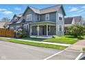 Charming two-story home with a covered porch with simple white pillars and a well-maintained front yard at 516 S 10Th St, Noblesville, IN 46060