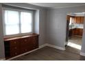 Cozy living room with a vintage cabinet and a large window providing plenty of natural light at 548 S Vine St, Indianapolis, IN 46241