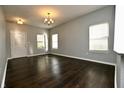 Open living area featuring hardwood floors and neutral paint at 5828 Long Lake Ln, Indianapolis, IN 46235