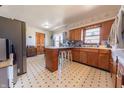 Functional kitchen with vintage charm, featuring wood cabinetry and an adjacent dining area at 594 Daugherty St, Columbus, IN 47201