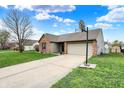 Beautiful single-story home with a long driveway, lush lawn, and basketball hoop at 8312 Eagles Nest Dr, Avon, IN 46123