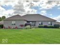 Well-maintained home showcases lush green lawn and manicured landscaping, enhancing curb appeal at 8890 N Pennington Rd, Mooresville, IN 46158