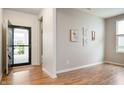 Inviting foyer with wood floors, neutral walls, and ample natural light at 12914 Shiraz Ln, Fishers, IN 46037