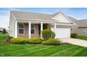 Inviting single-story home showcasing manicured lawn, brick accents, and a well-maintained exterior at 12914 Shiraz Ln, Fishers, IN 46037