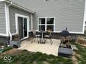 Outdoor patio area with dining set and barbecue grill, perfect for entertaining guests in the backyard at 1573 Vera Blvd, Danville, IN 46122