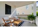 Inviting front porch with comfortable seating and a stylish outdoor rug at 1614 Waterleaf Dr, Westfield, IN 46074