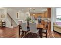 Open-concept dining area with modern light fixtures and a view of the kitchen at 16758 Bingham Dr, Westfield, IN 46074