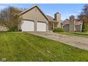 Charming single-Gathering home with a two-car garage and a stone chimney at 1736 Sandoval Ct, Indianapolis, IN 46214