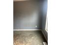 Bedroom featuring painted walls, white trim, a window, and worn floors at 205 S 8Th St, Noblesville, IN 46060