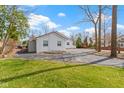 Charming exterior with a circular driveway, lawn, and trees in a well-maintained landscape at 2469 Cape Henry Ct, Cicero, IN 46034