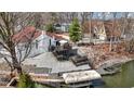 A multi-tiered deck and dock lead to the lake, enhancing the property's outdoor living space at 2469 Cape Henry Ct, Cicero, IN 46034
