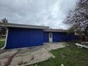 Home with blue siding and a concrete patio, perfect for outdoor relaxation and entertaining at 3162 Wallace Ave, Indianapolis, IN 46218