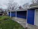 This home offers a covered carport and blue siding at 3162 Wallace Ave, Indianapolis, IN 46218
