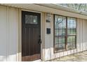 Inviting front entrance featuring a dark wooden door and large window, creating a warm welcome at 3703 Dubarry Rd, Indianapolis, IN 46226